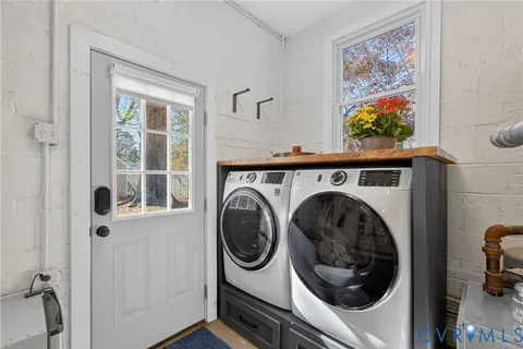 a bed room with a bed and a lamp