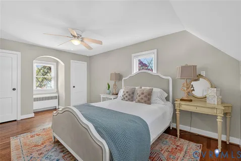 a bedroom with a bed and a chair