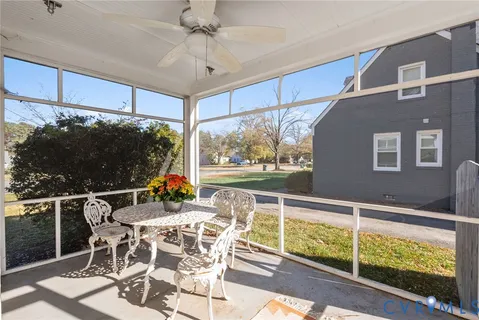 a view of a chairs and table in the balcony