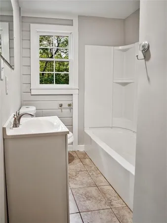 a kitchen with a stove a sink and a refrigerator