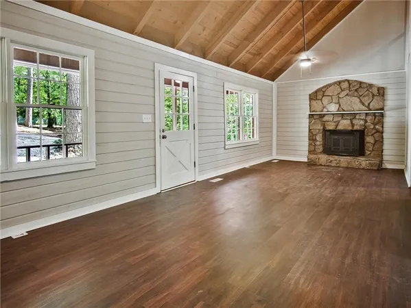 a view of an entryway with wooden floor