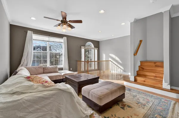a bedroom with two beds and a large window