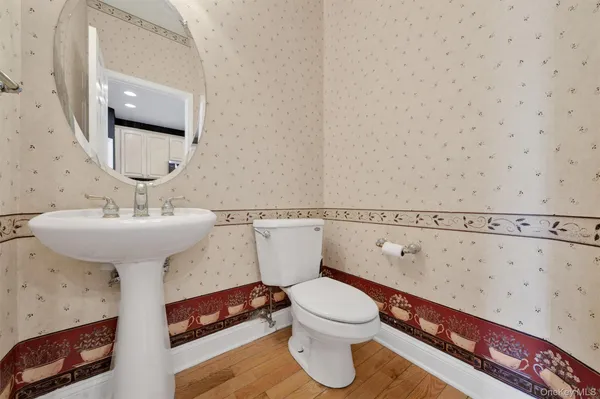 a bathroom with a sink toilet and vanity