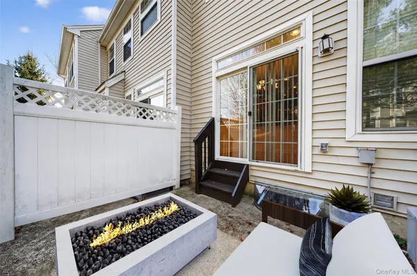 a view of two chairs in the porch