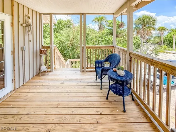 a balcony view with a seating space