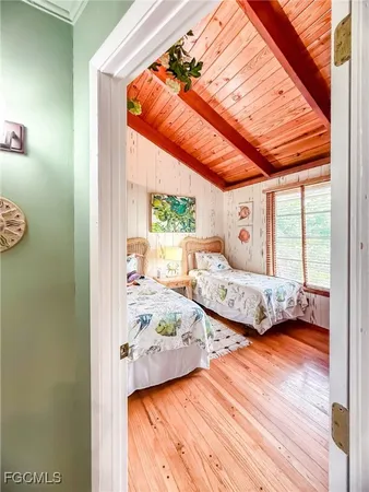 a bedroom with furniture and a window