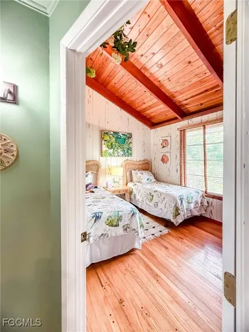 a bedroom with furniture and a window