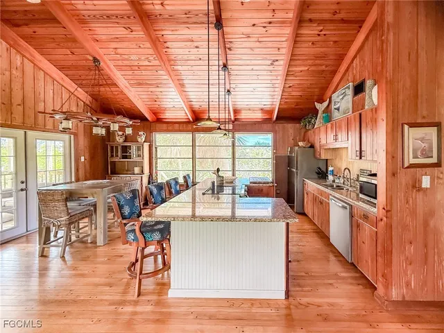 a large white kitchen with lots of counter top space