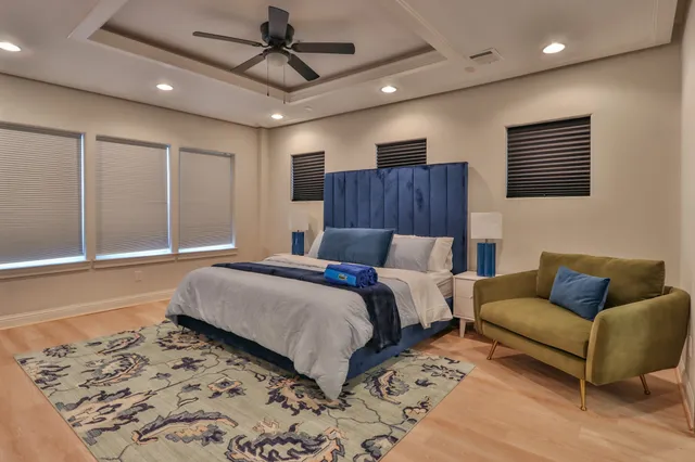 a bedroom with a large bed and a couch