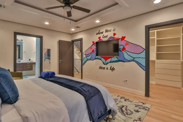 a bedroom with a bed and a dresser