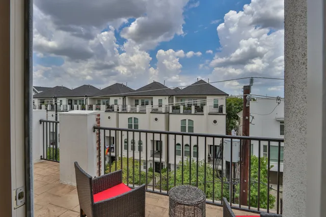 a view of a houses with a balcony