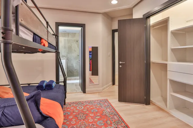 a view of a hallway with furniture and front door