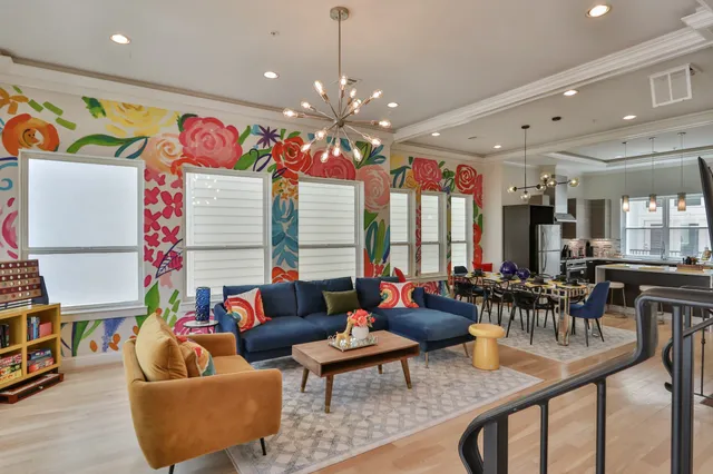 a very nice looking living room with furniture and a large window