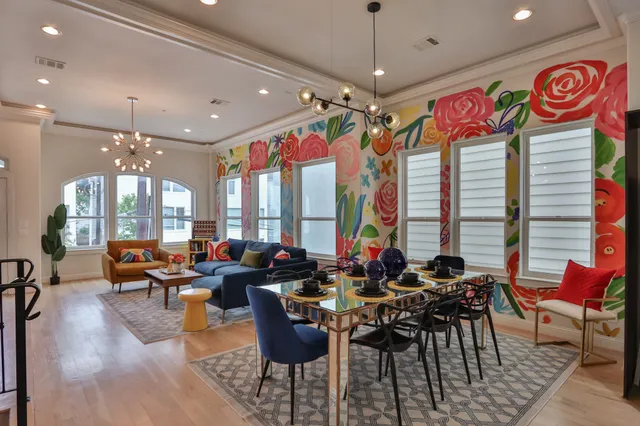 a very nice looking living room with furniture and a large window