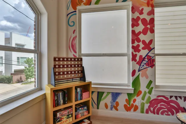 a view of an entryway with wooden floor