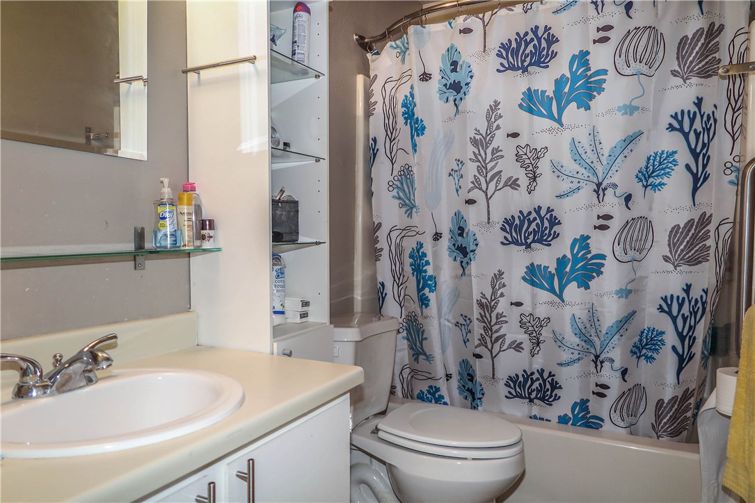 3905 Chase Circle, Unit B Austin, TX 78721 - Photo 17 of 18 a bathroom with a sink and toilet