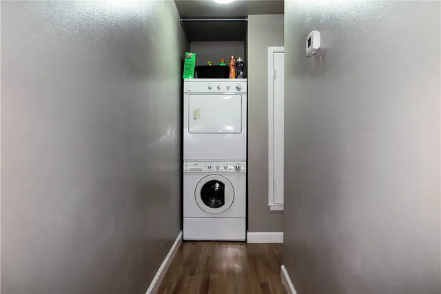 a view of a hardwood & utility room with a sink