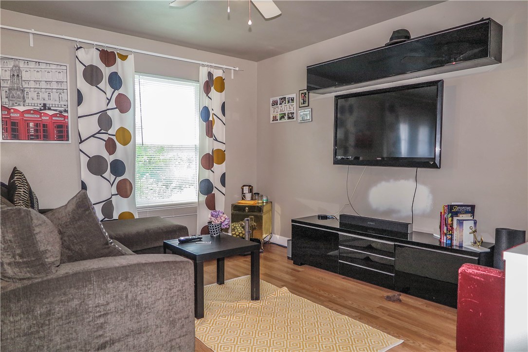 3905 Chase Circle, Unit B Austin, TX 78721 - Photo 5 of 18 a living room with furniture and a flat screen tv