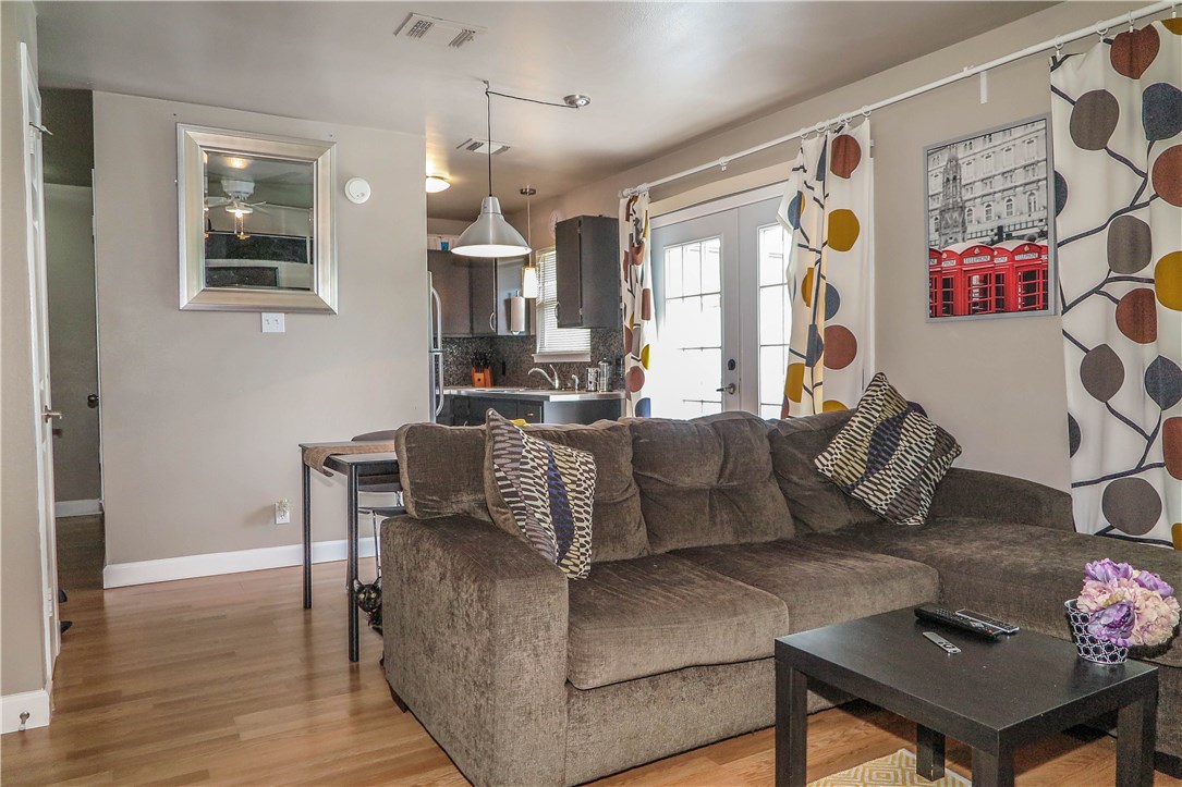 3905 Chase Circle, Unit B Austin, TX 78721 - Photo 7 of 18 a living room with furniture and wooden floor