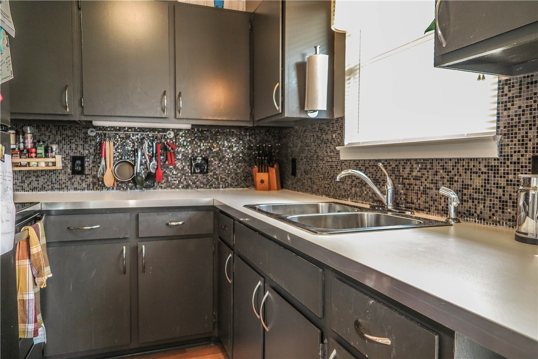 3905 Chase Circle, Unit B Austin, TX 78721 - Photo 9 of 18 a kitchen with a sink and cabinets