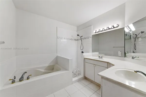 a bathroom with a double vanity sink mirror and double