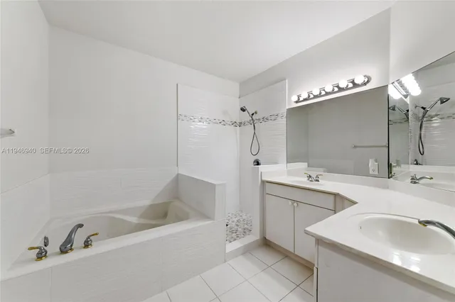 a bathroom with a double vanity sink mirror and double