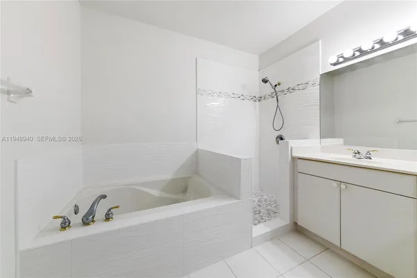 a view of wooden floor and windows in a room