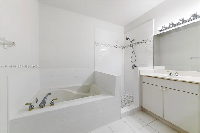 a view of wooden floor and windows in a room