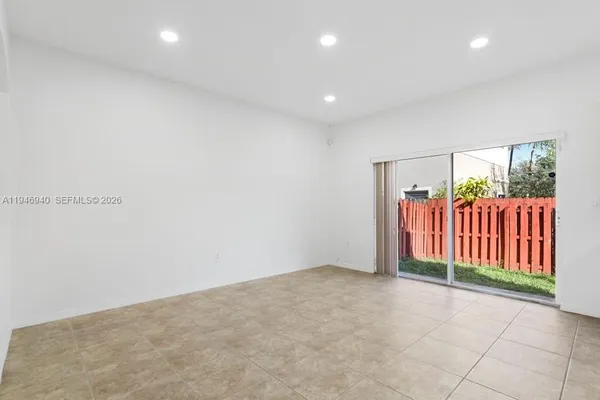 a view of a kitchen with a sink and cabinets