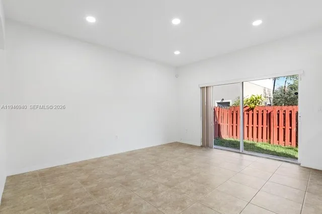 a view of a kitchen with a sink and cabinets