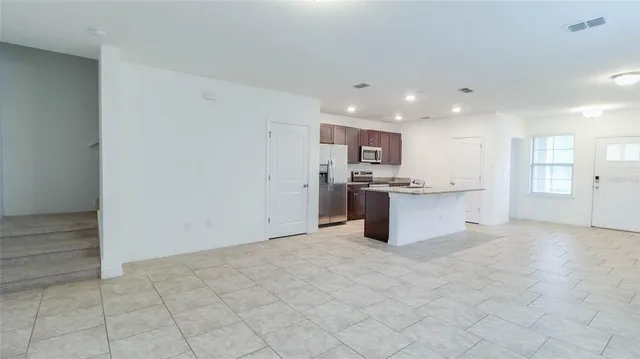 a white toilet sitting next to a white sink