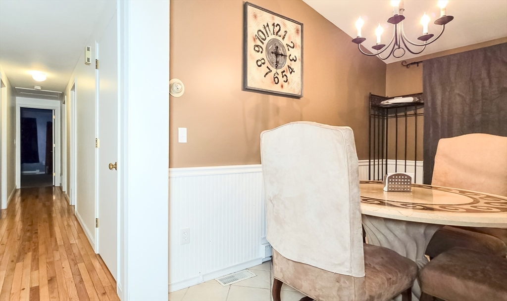 7 Roosevelt Street Wareham, MA 02571 - Photo 13 of 28 a view of a dining room with furniture and wooden floor