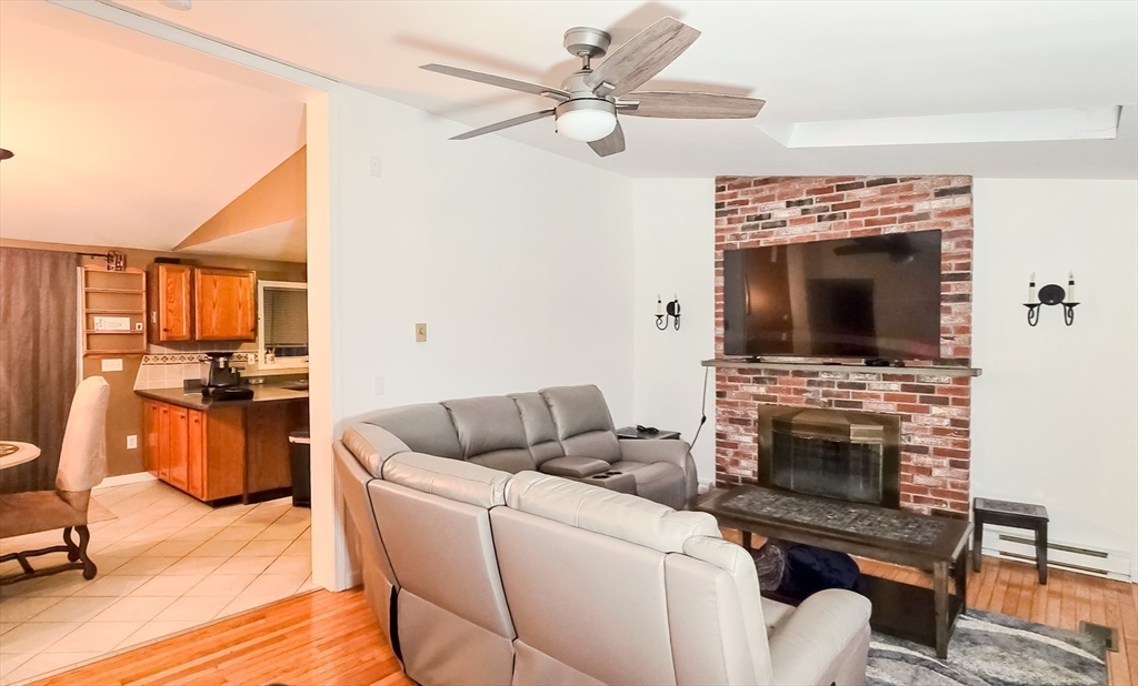 7 Roosevelt Street Wareham, MA 02571 - Photo 18 of 28 a living room with furniture and a fireplace