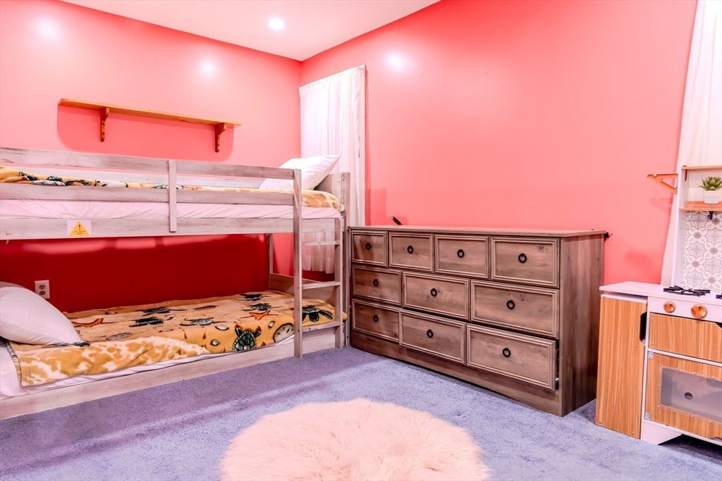 7 Roosevelt Street Wareham, MA 02571 - Photo 21 of 28 a bed room with a bed and a dresser