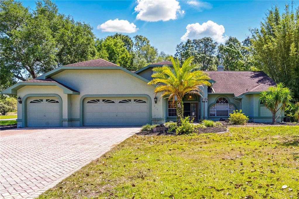424 Knights Bridge Road Spring Hill, FL 34609 - Photo 1 of 1 a view of a house with a yard