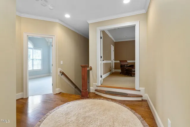 a front view of a house with a yard and fountain