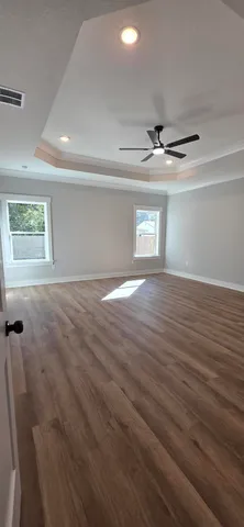 a view of a hardwood & utility room