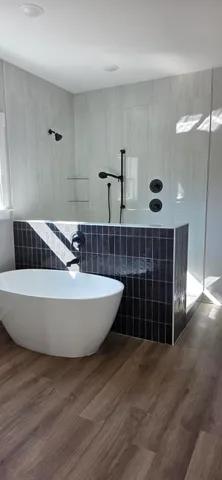 a bathroom with a double vanity sink mirror and toilet