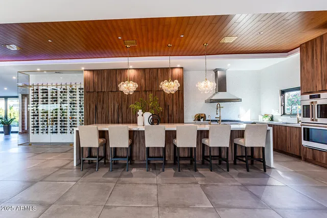 a kitchen with stainless steel appliances a sink and cabinets