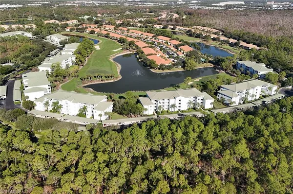 an aerial view of a residential houses with outdoor space