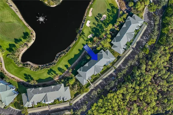 an aerial view of a residential houses with outdoor space