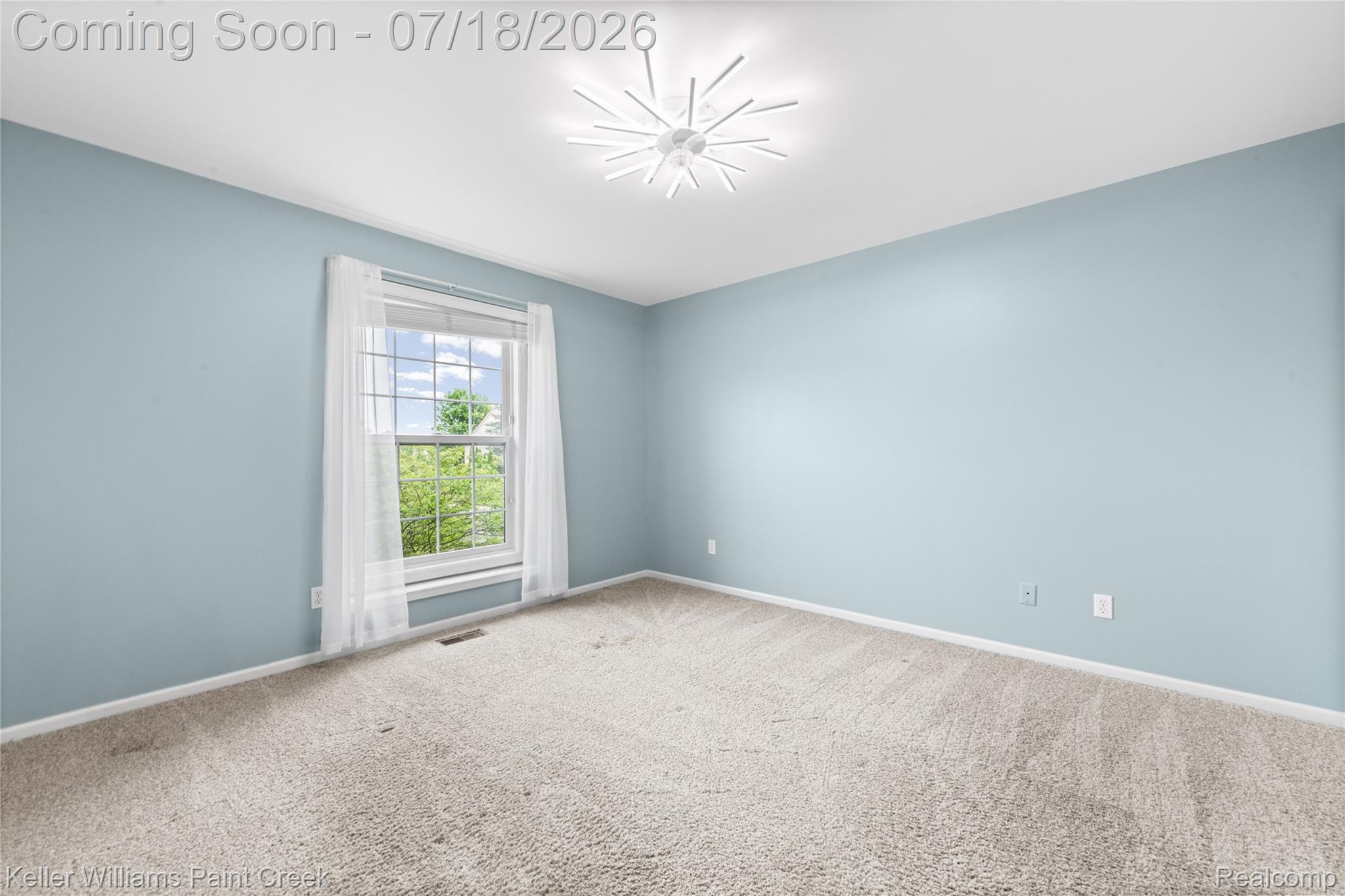 4230 Holly Lane Rochester, MI 48306 - Photo 41 of 64 Spacious room featuring light blue walls and neutral carpet flooring
