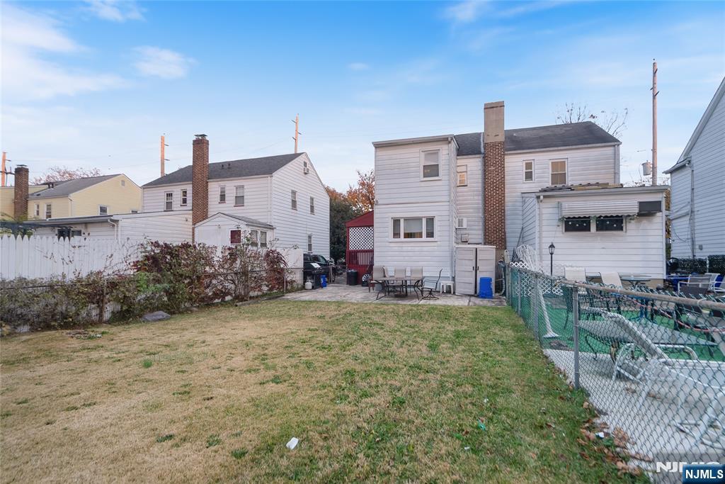 205 North 15th Street Bloomfield, NJ 07003 - Photo 11 of 30 a view of a big house with a big yard and large trees