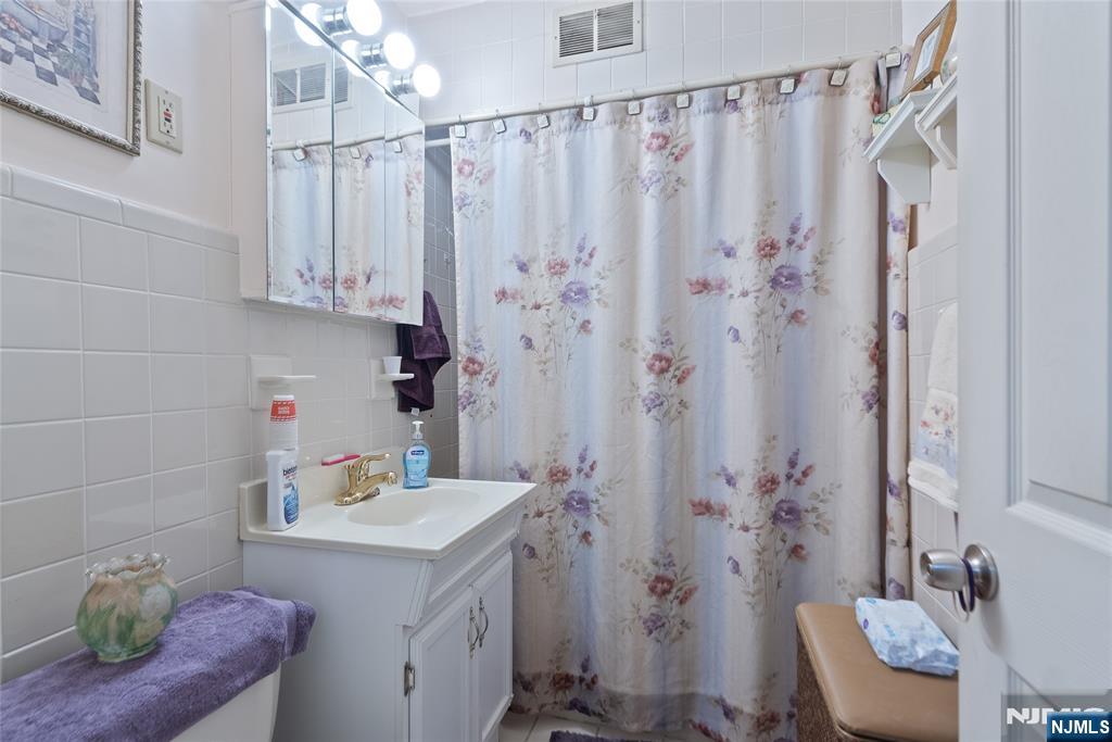 205 North 15th Street Bloomfield, NJ 07003 - Photo 13 of 30 a bathroom with a sink toilet and shower