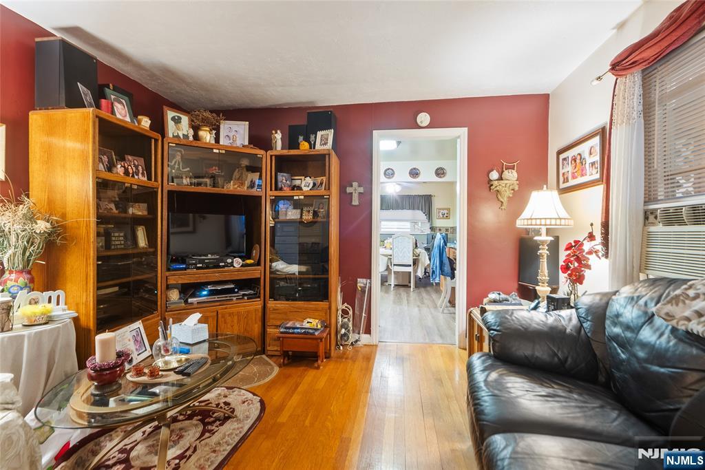 205 North 15th Street Bloomfield, NJ 07003 - Photo 21 of 30 a living room with furniture and a flat screen tv