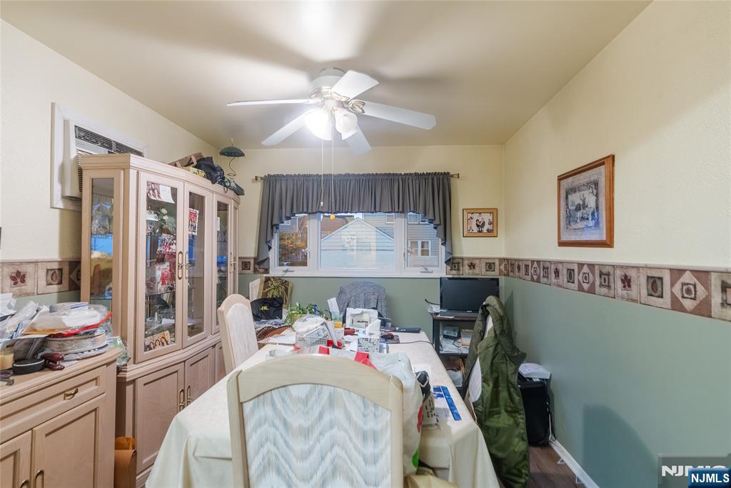 205 North 15th Street Bloomfield, NJ 07003 - Photo 23 of 30 a bedroom with furniture and a chandelier