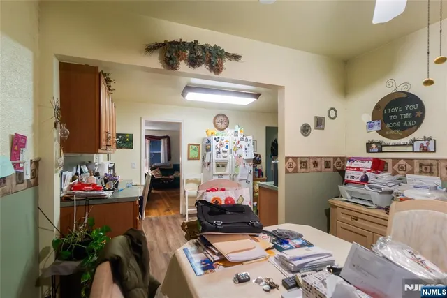 a living room with furniture and a clock