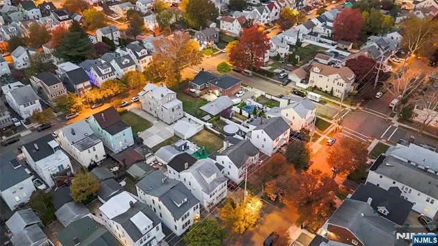 an aerial view of residential building with parking