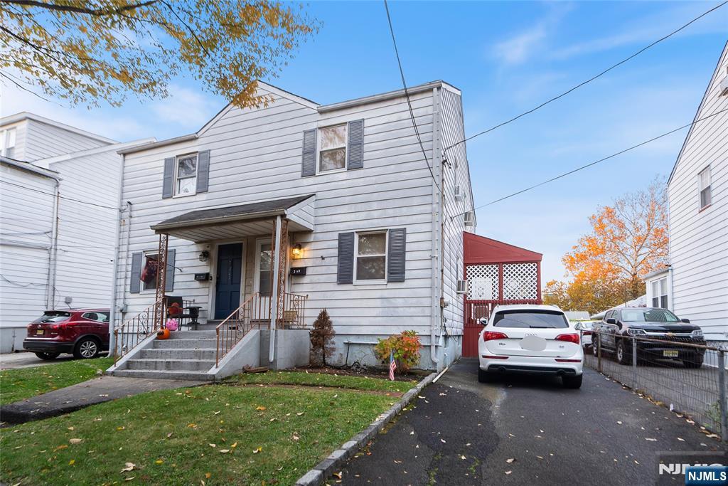 205 North 15th Street Bloomfield, NJ 07003 - Photo 7 of 30 a couple of cars parked in front of a house