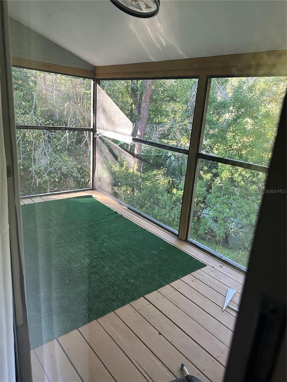 7027 Paul Revere Terrace New Port Richey, FL 34653 - Photo 18 of 20 a view of a room with wooden floor and outdoor space